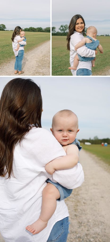 Mom holding on a baby boy while walking looking back and smiling while getting her portraits done by a Newnan Family Photographer
 