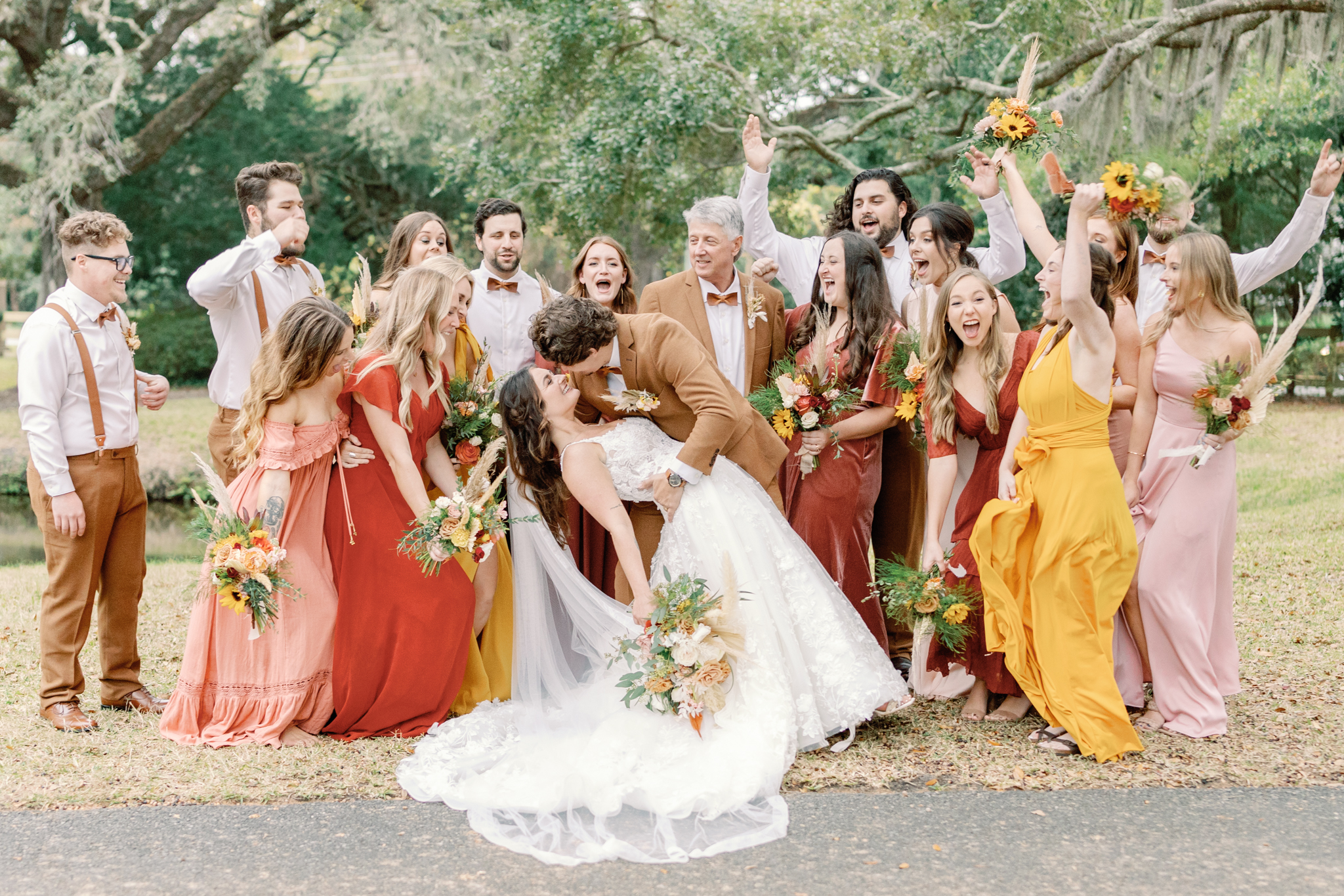 Bridal and groom party celebrating on their wedding day taken by Holly Ann Co. a St. Simons Wedding photographer