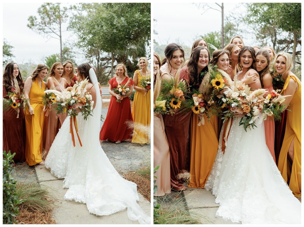 The bride and her bridesmaids are hugging and smiling outside 