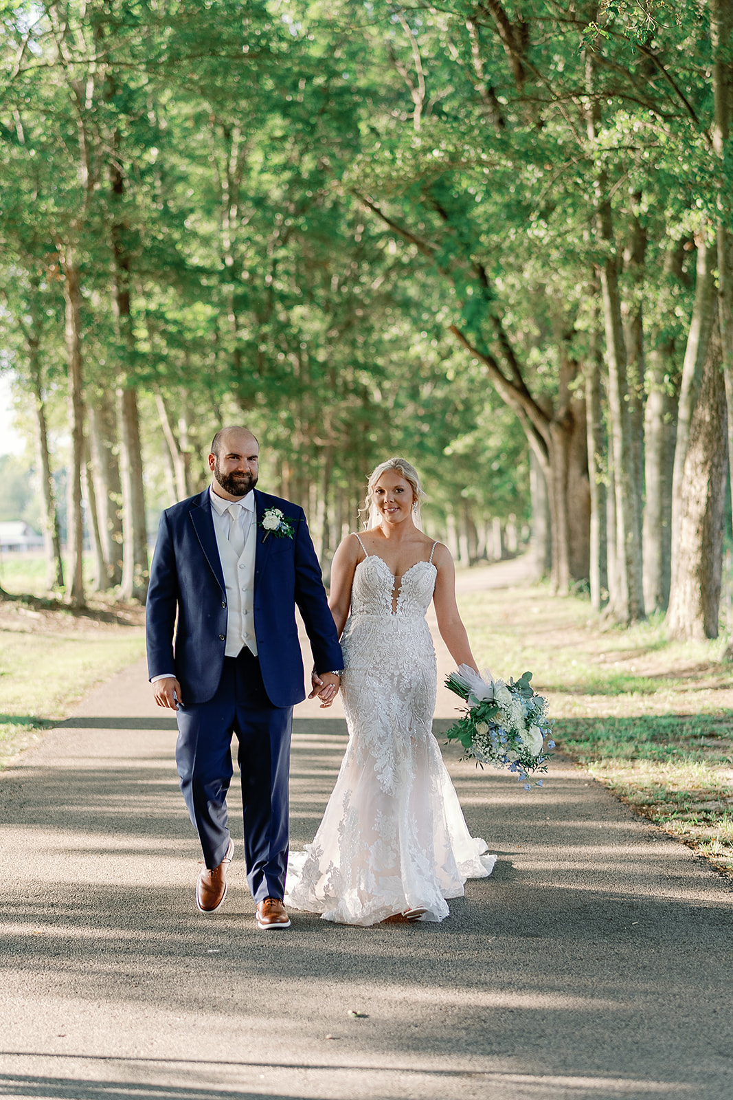 Bride and Groom walking together smiling and laughing to each other shortly after getting married, Barnesville ga venues